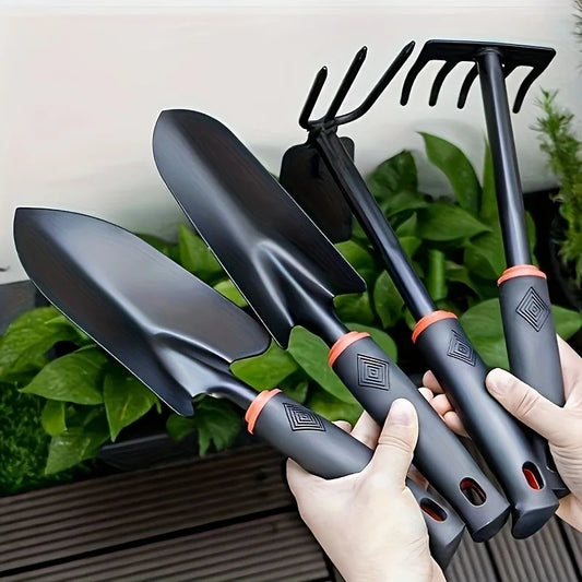 A Set of Four Outdoor Gardening Tools Including a Small Shovel for Planting Flowers, a Five-Pronged Rake, a Double-Headed Rake
